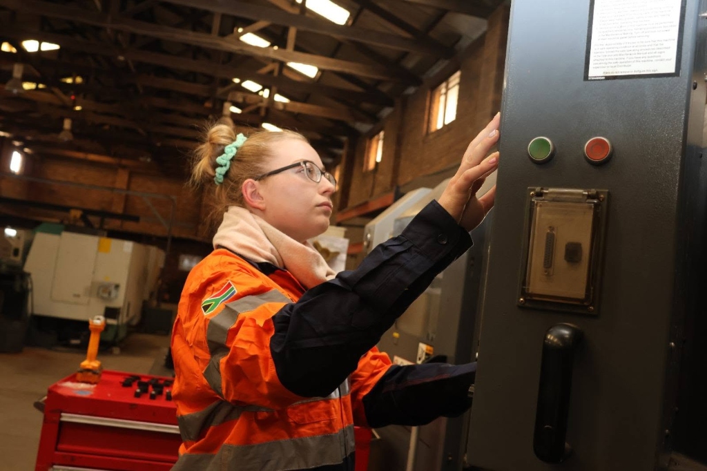 CNC Machinist Operating Precision Machine